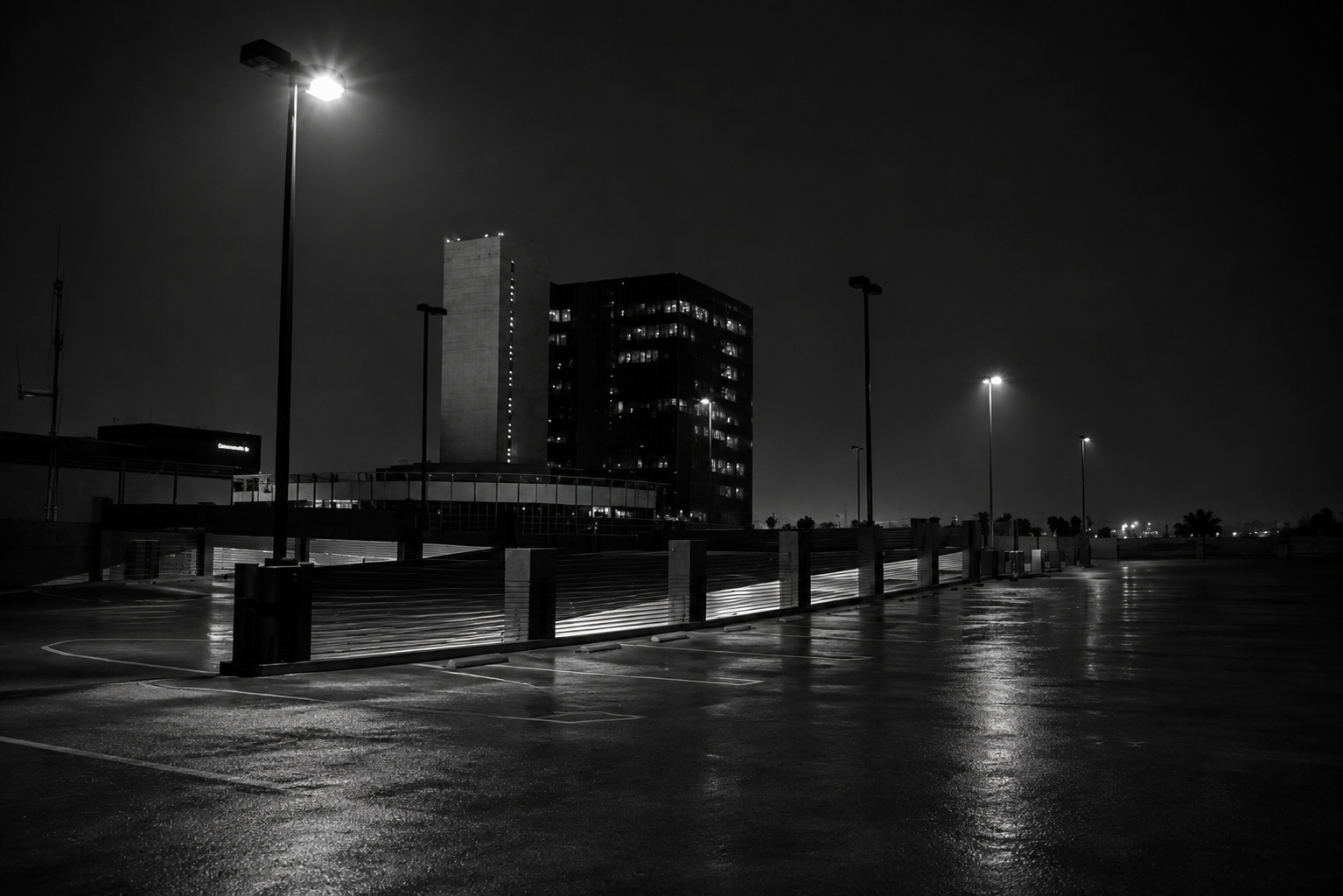 Empty lot at night under street lights